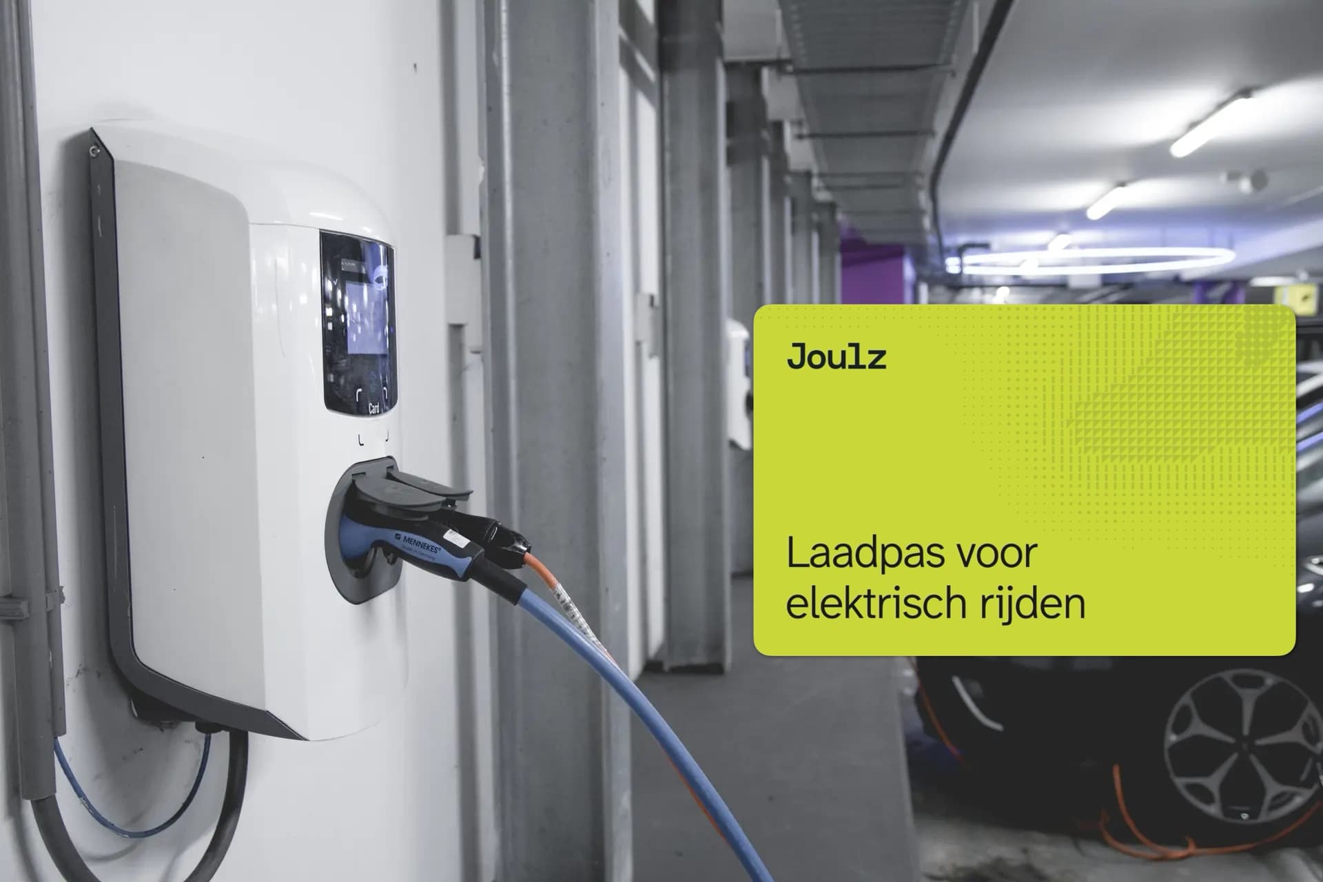 Electric car charging station in a parking garage with a Joulz charging card